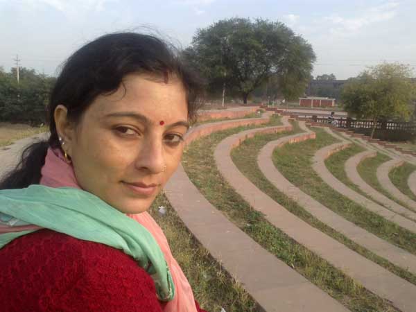 With my wife (Suti) at sector 42, near Beant Singh memorial, sitting on stairs while viewing children playing cricket on the campus